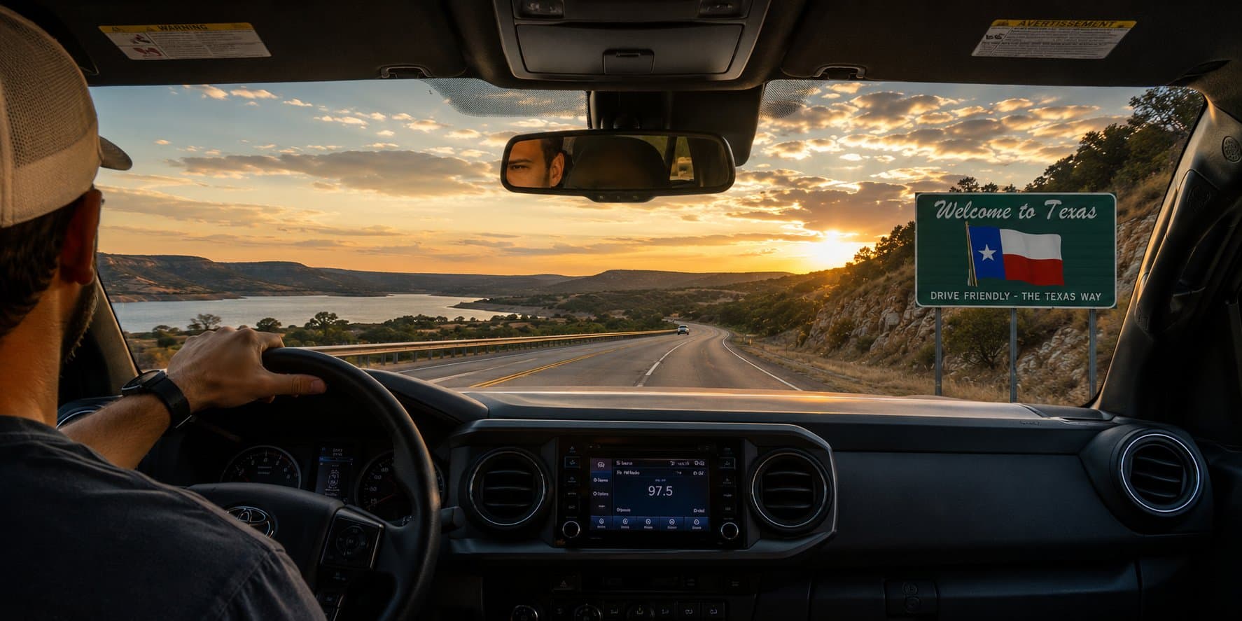Driving on a Texas highway toward sunset